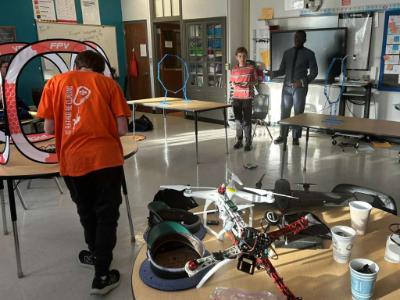 Cadets work with students in the classroom.